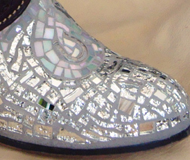 Close-up of toe with horseshoe, Splendor in the Glass boot sculpture